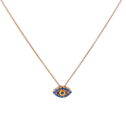 A gold-tone necklace featuring a blue and gold evil eye pendant on a chain.