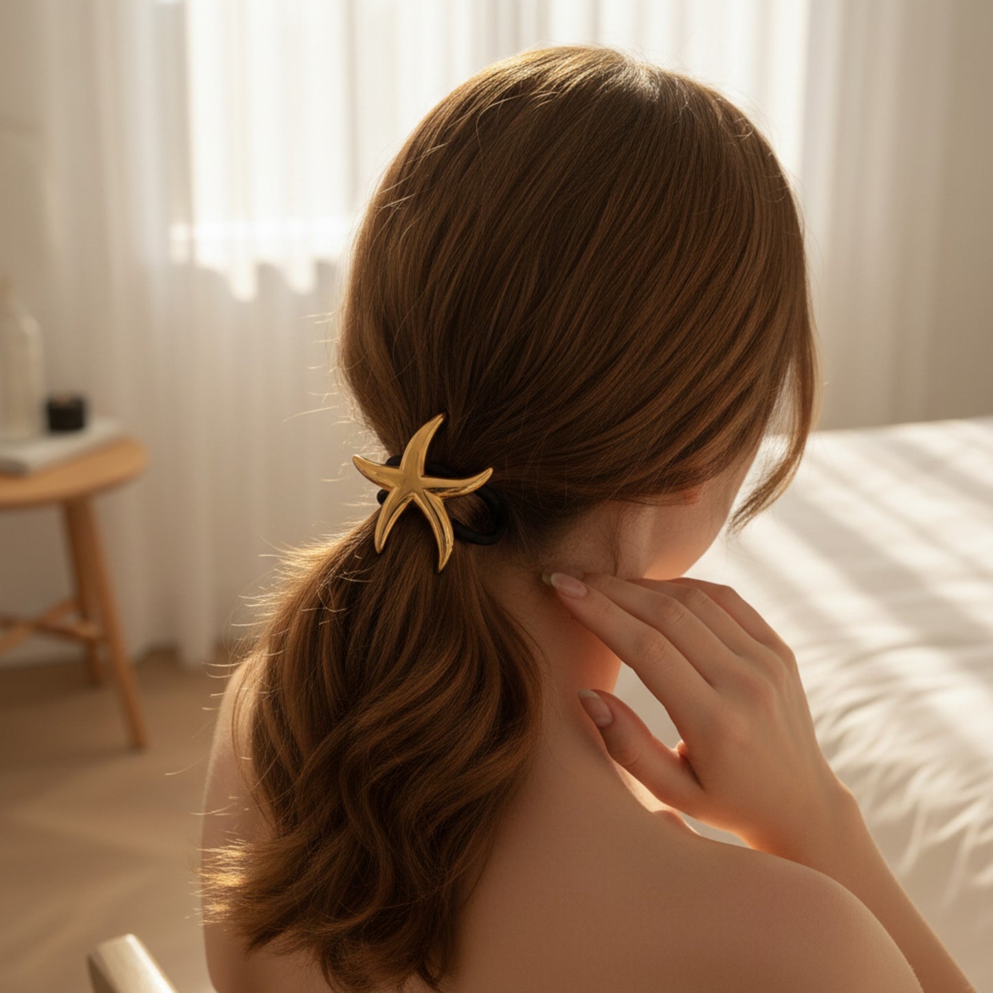Gold Starfish Hair Tie styled as a playful ocean-inspired hair accessory