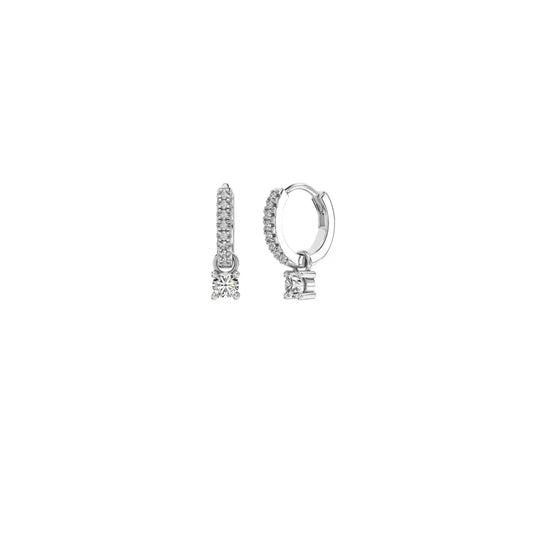 A pair of huggie earrings with a row of pavé-set stones and a dainty zirconia drop charm, crafted from a 925 Sterling Silver base.