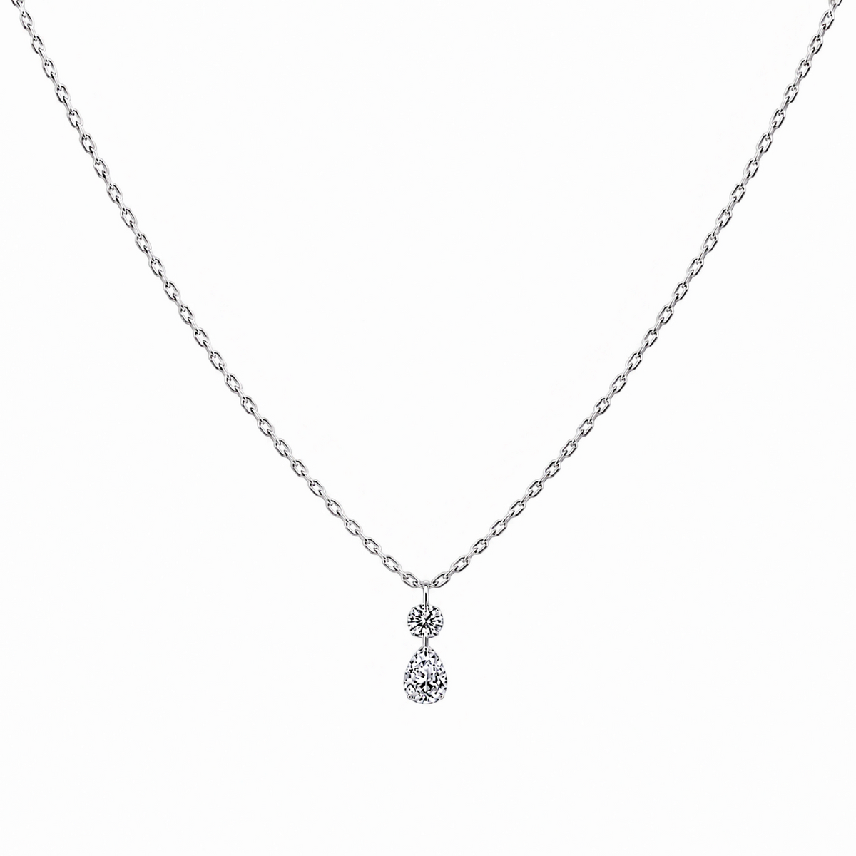 Scandal Kiss rhodium-plated sterling silver necklace featuring a round and pear-shaped zirconia drop pendant.