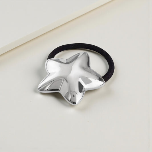Silver Star Hair Tie - polished silver-tone star on black elastic
