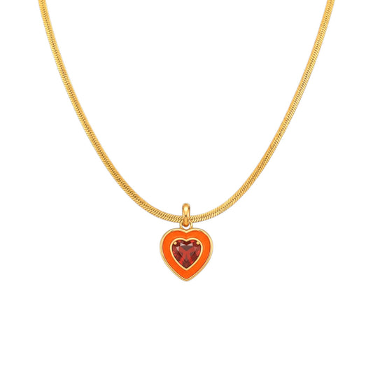 Scandal Kiss Colour Pop Necklace with orange and red heart-shaped stone detail on a gold snake chain