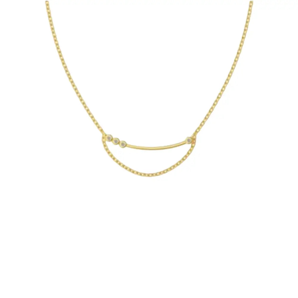 A silver curved chain necklace with bezel-set stones on one side and a softly draped chain detail beneath. The necklace is displayed against a white background.