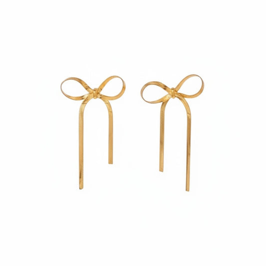 Gold long bow ribbon stud earrings with an elongated sculptural silhouette