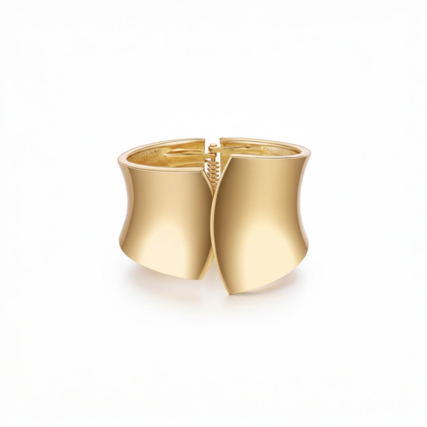 Gold Sculpted Cuff Bracelet in gold plated alloy with wide curved sculptural design