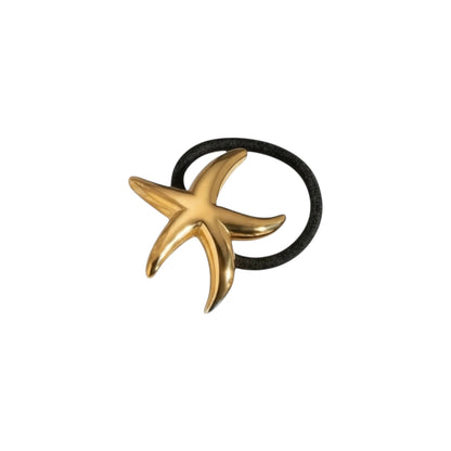Scandal Kiss gold starfish hair tie with a black elastic band, made of stainless steel with 18ct gold plating.