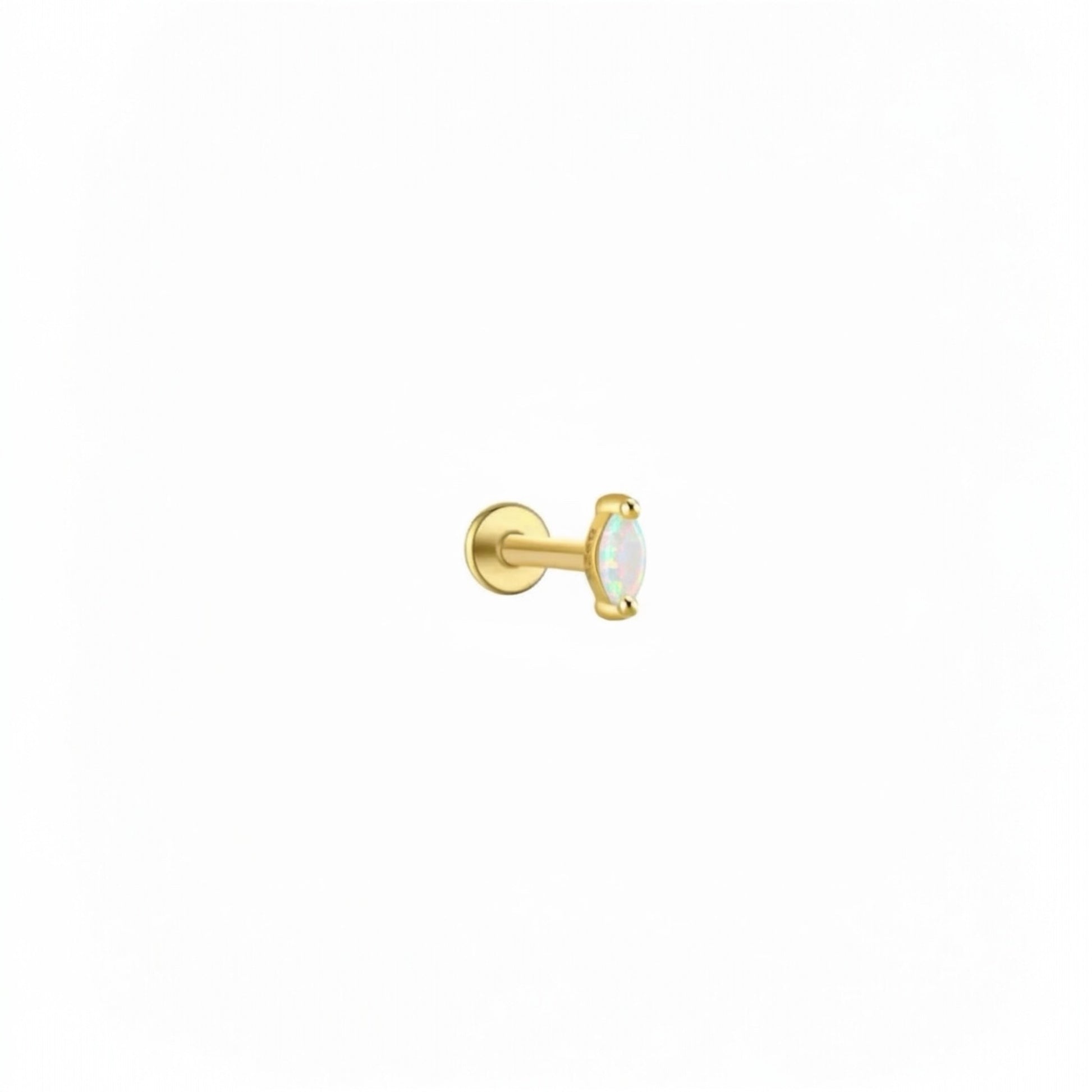 Gold iridescent cartilage stud earring with luminous crystal stone.