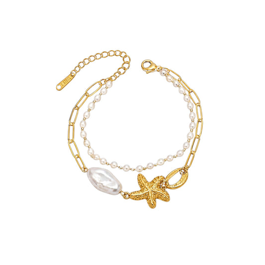 Gold Pearl Shell Bracelet with a dual-strand design, baroque-style pearl strand, sculpted shell and starfish details