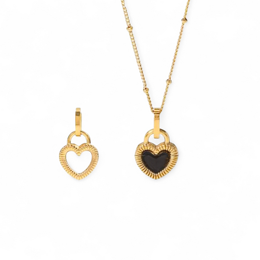 Reversible heart necklace with black and white sides in 18ct gold plated stainless steel on a beaded chain