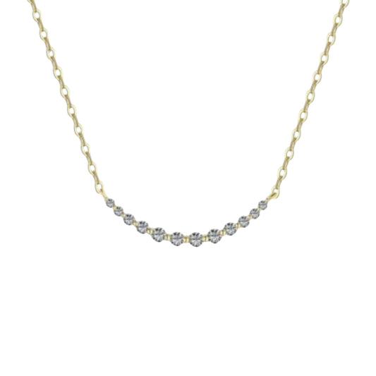 Scandal Kiss gold-tone curved bar necklace with delicate shimmering stones on a minimalist chain.