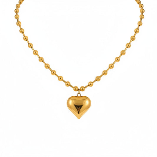 Scandal Kiss gold plated stainless steel necklace with glossy sculpted heart pendant and polished bead chain.