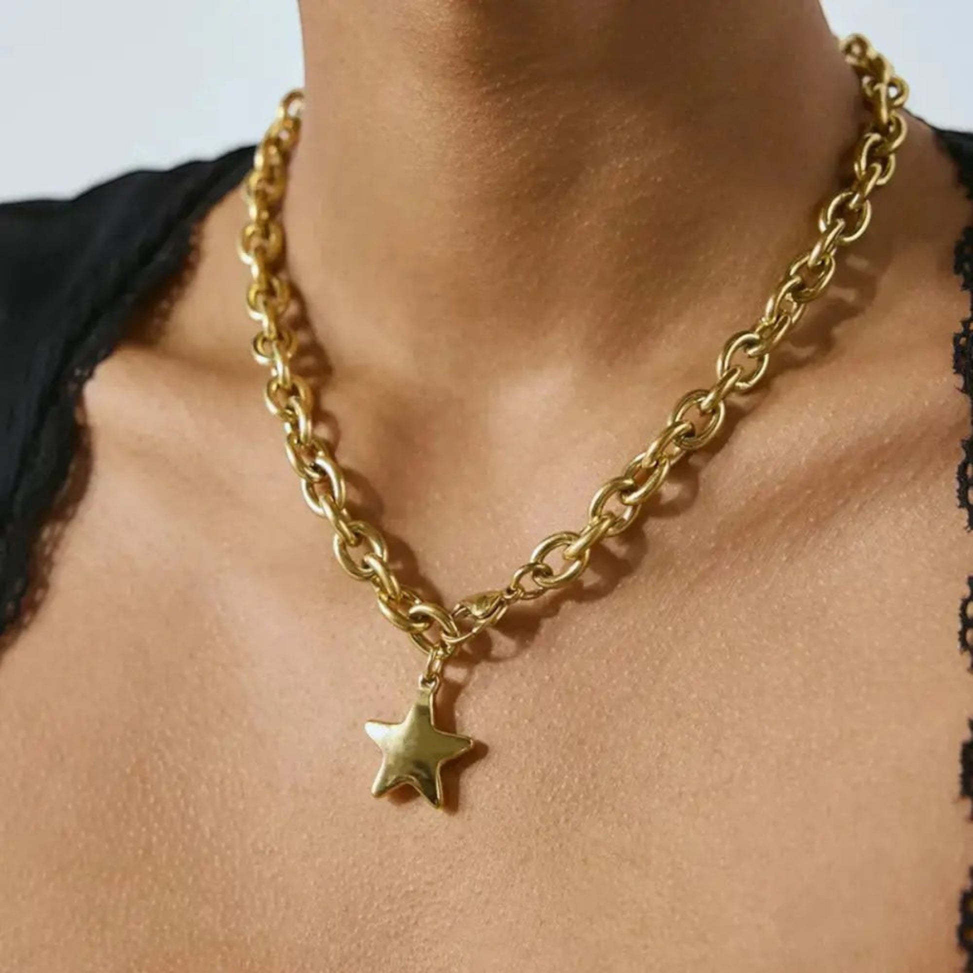 Scandal Kiss gold-toned star charm necklace on a bold link chain, crafted from 18ct gold-plated stainless steel.