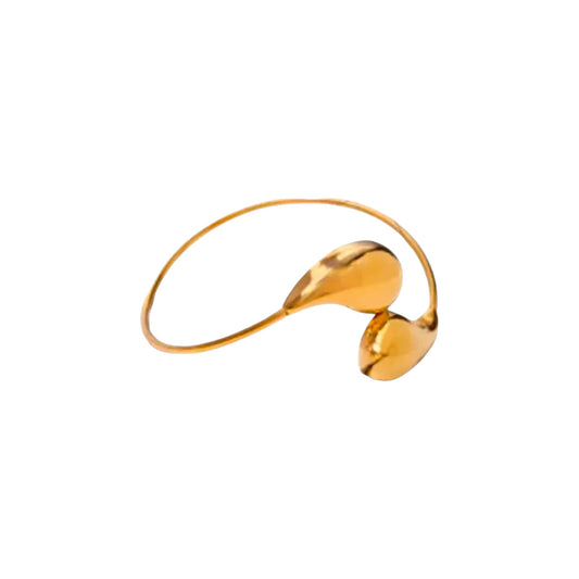 Scandal Kiss gold plated stainless steel open cuff bracelet featuring two smooth teardrop-shaped ends.