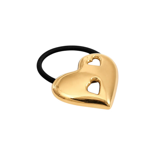 Scandal Kiss Golden Heart Hair Tie featuring a polished 18ct gold-plated stainless steel heart with cutout details.