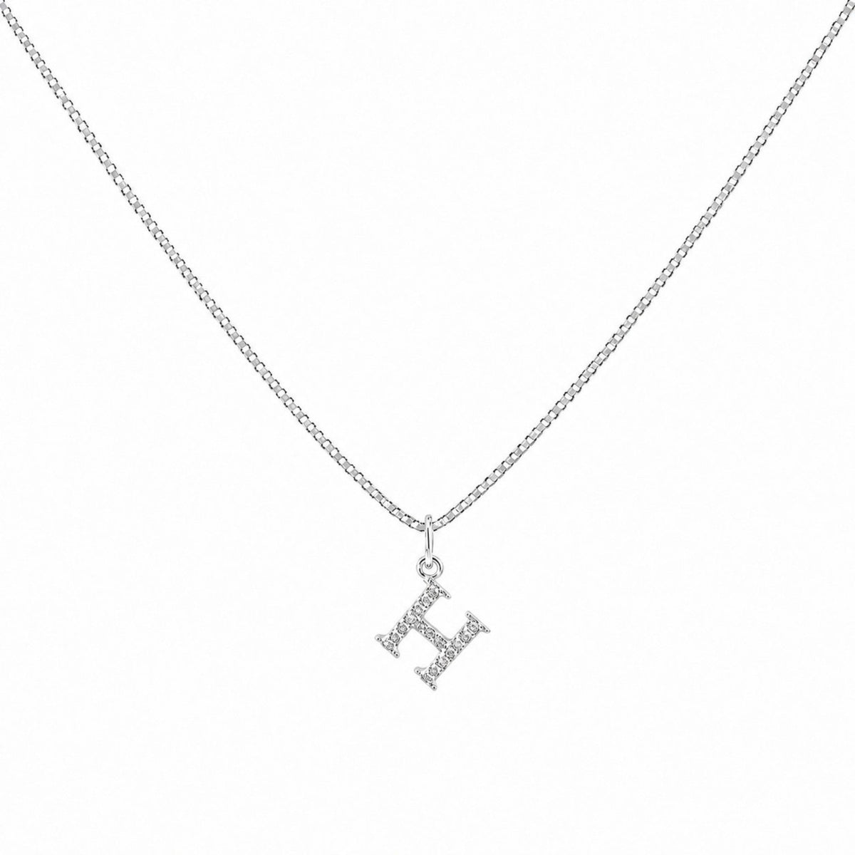 Scandal Kiss sterling silver initial H charm necklace with shimmering zirconia stones on a delicate chain