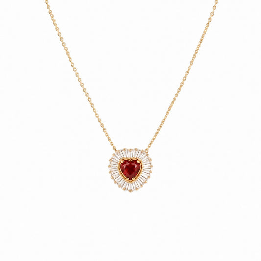 Scandal Kiss Red Heartburst Necklace featuring a heart-shaped red stone with a baguette-cut halo on a gold chain.