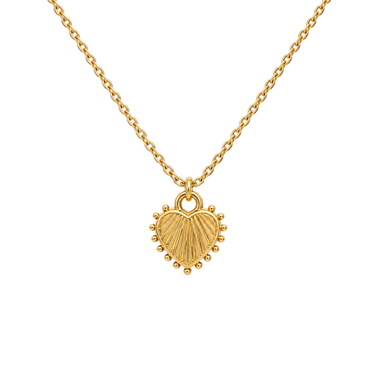 Scandal Kiss gold heart necklace with linear texture and polished beaded edge on a delicate chain.