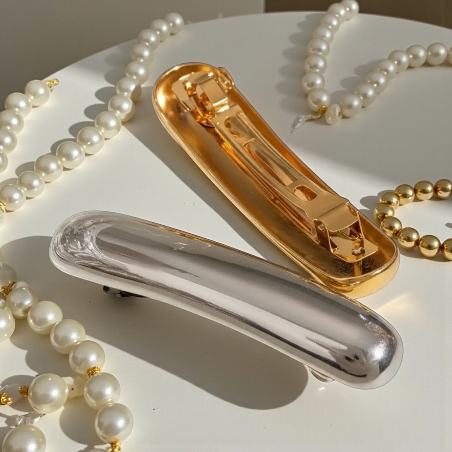 Gold and Silver Sleek Curve Hair Clips in Stainless Steel with smooth curved designs