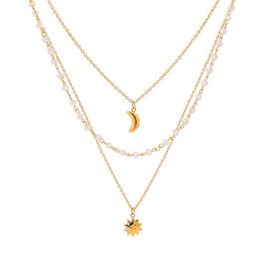 Sun and Moon Layered Necklace in Stainless Steel with 18ct Gold plating featuring three layered chains with sun, moon and beaded details.