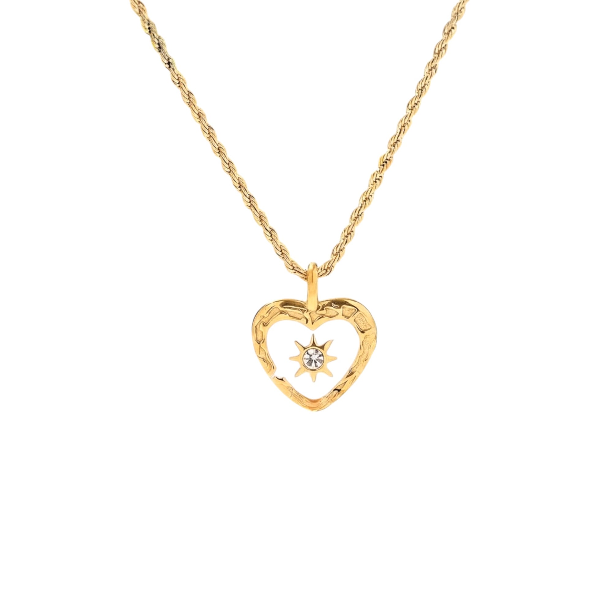 Gold heart pendant necklace with white enamel centre and sparkling sunburst detail