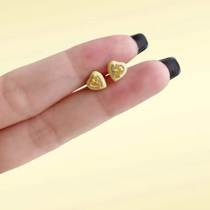 Yellow enamel heart stud earrings in gold plated sterling silver with a glossy finish